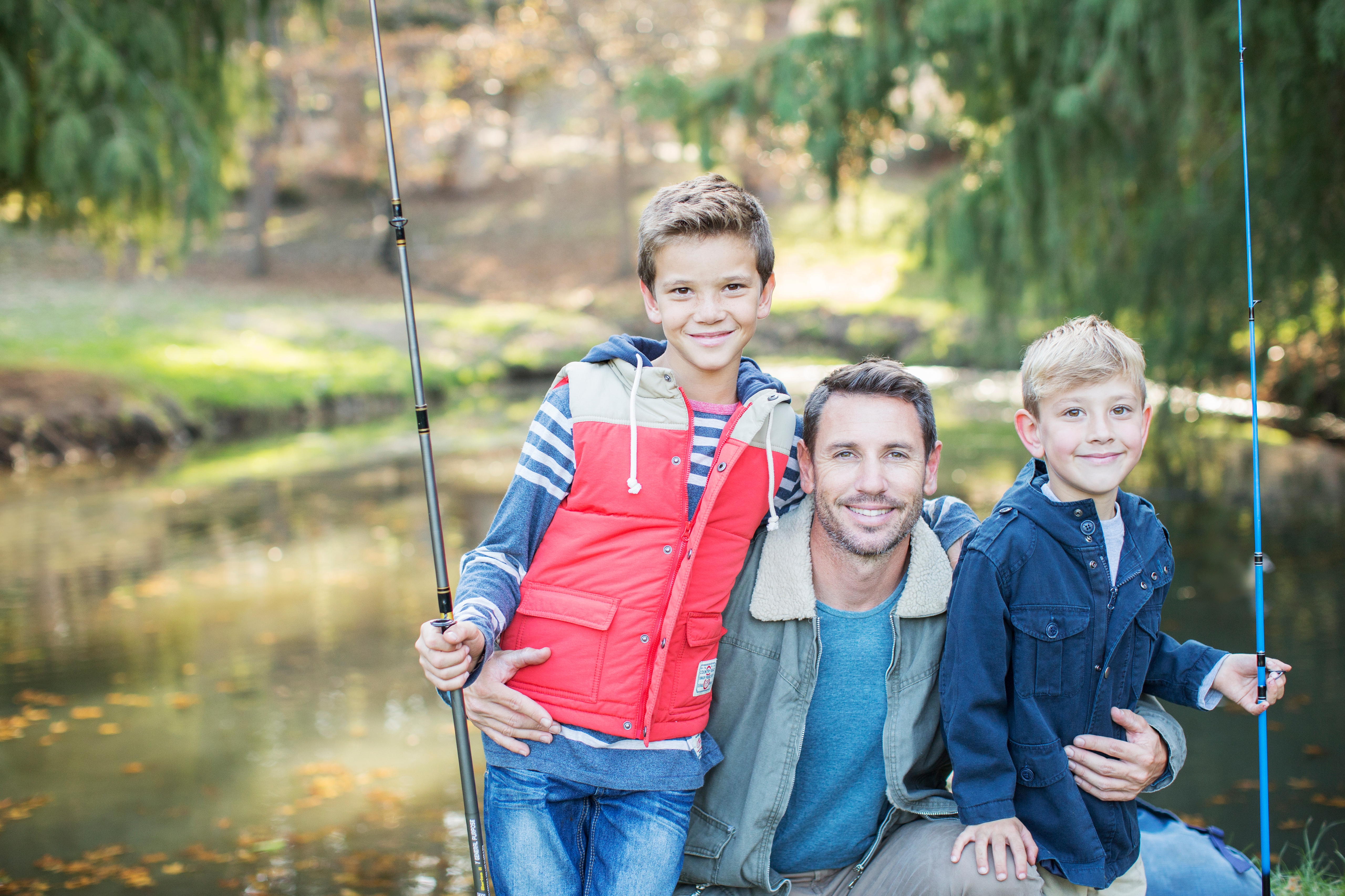 dad and sons fishing poles